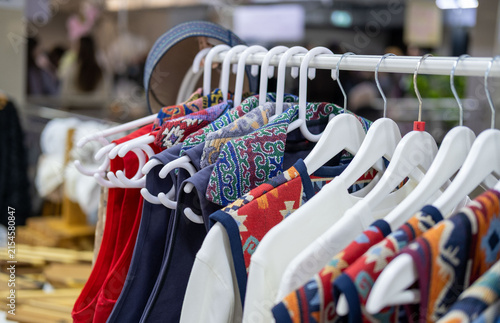 Obraz na płótnie Modern clothing inspired by Kazakh asian traditional culture, featuring ethnic patterns, colorful garments and a traditional Kazakh skullcap in a contemporary fashion setting