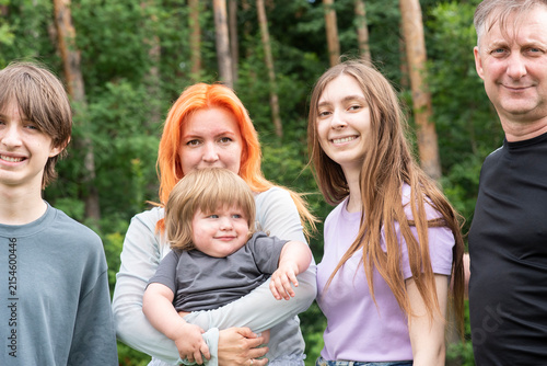 Happy big family with children in summer nature forest