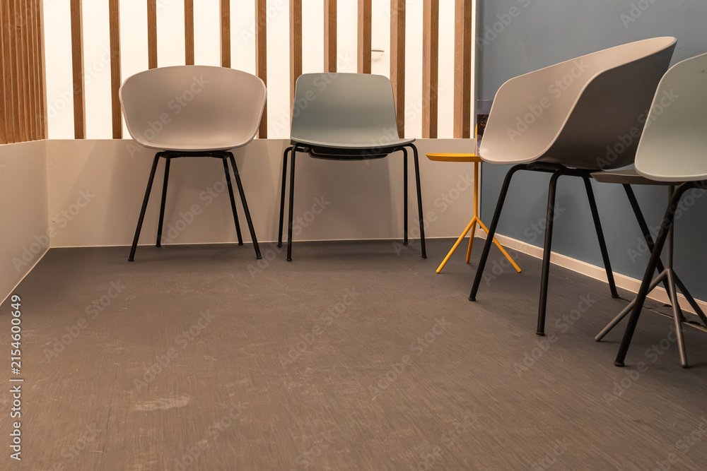 Obraz premium Chairs arranged in a waiting room with a simple design and modern style