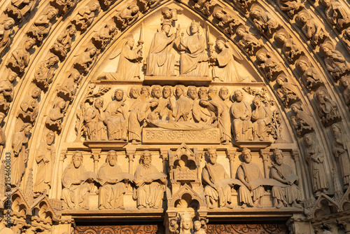 Obraz na płótnie Paris, France: One of the three tympana on the main entrance facade of Notre-Dam