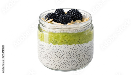 Healthy chia seed pudding with green fruit puree and fresh blackberries in a glass jar