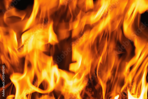 Fotografie Abstract inferno background filled with swirling orange and yellow flames