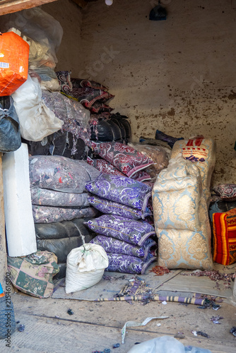 Canvas Print Sacks of stuffing and cheap textile for sale in a market in Rissani, Morocco