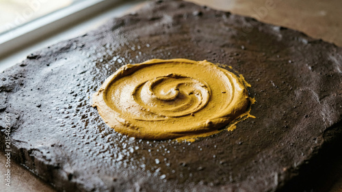 Mustard Yellow Pigment Swirl on Dark Clay Texture
