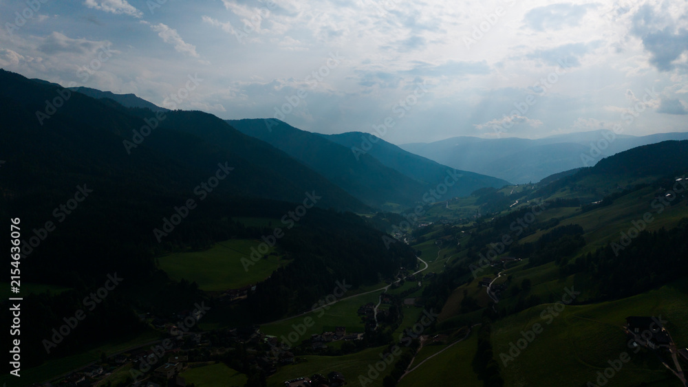 Obraz premium Majestic scenery of rough mountain ridge near grassy hills 