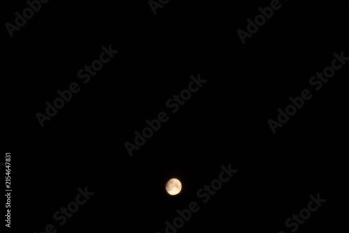 The full moon on black background with copy space 