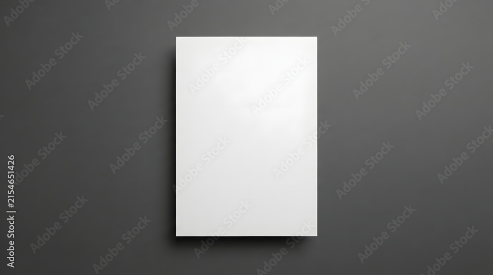 Fototapeta premium Empty blank white paper frame mockup on dark gray backdrop for design templates and presentations