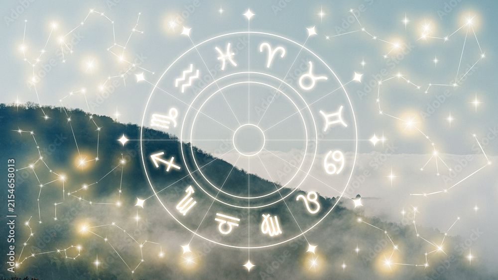 Naklejka premium Astrology zodiac signs displayed on a cloudy mountain background during daylight