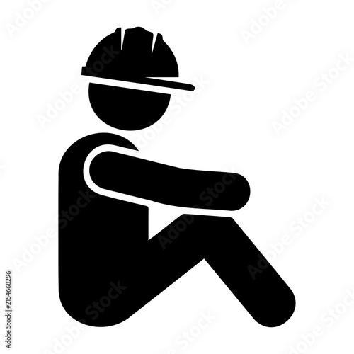 Foto Black silhouette of construction worker sitting wearing hard hat for rest break concept