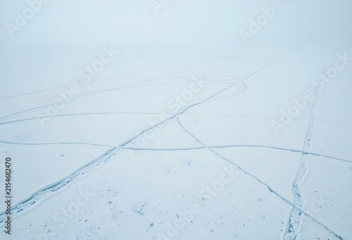 Frozen lake surface with ic...