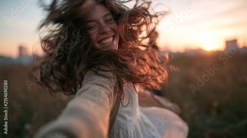 Happy Young Woman Spinning Outdoors During Golden Hour Sunset