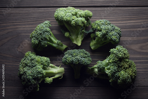 Fresh raw broccoli on wooden table