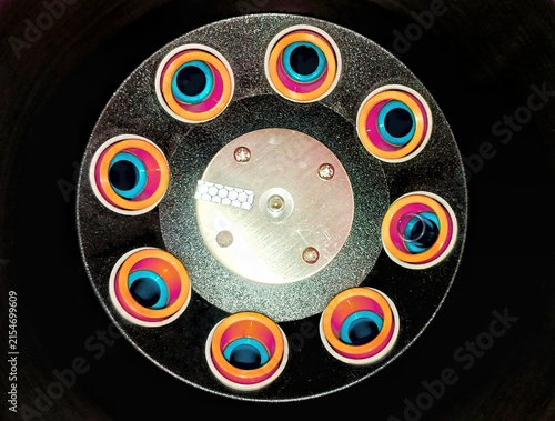 Fotografía Top view of a laboratory centrifuge with colorful microcentrifuge tubes loaded i