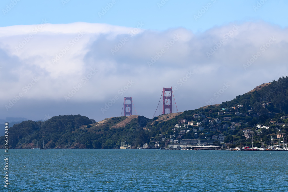 Fototapeta premium Distant Golden Gate Bridge View Over San Francisco Bay From Belvedere California