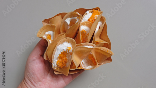 Traditional Thai Crispy Crepes with Sweet Filling in Paper Tray