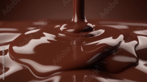 Thick, rich melted dark chocolate is poured, creating a smooth, glossy, and indulgent.