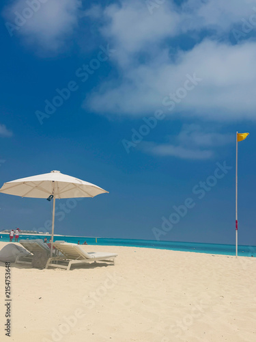 Tropical Beach with Umbrella and Turquoise Sea
