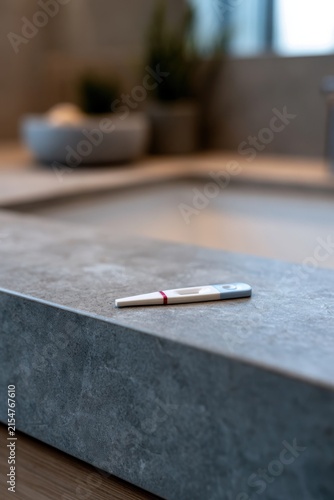 Minimalist countertop holds a pregnancy test