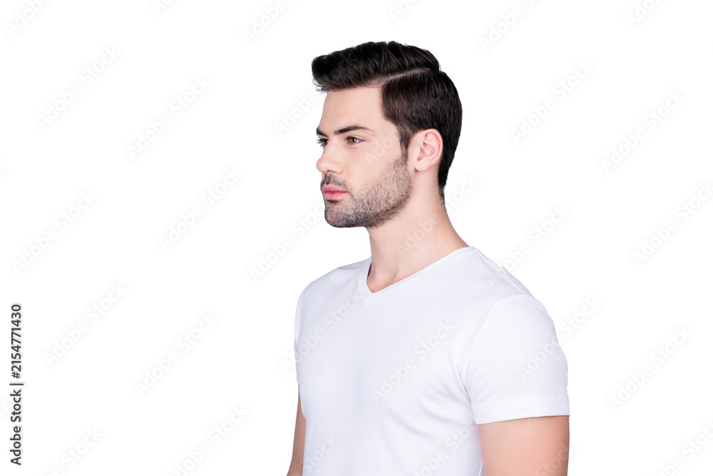 Obraz premium Portrait of half turned stunning man in white t-shirt with modern hairstyle soft smooth skin, isolated on grey background