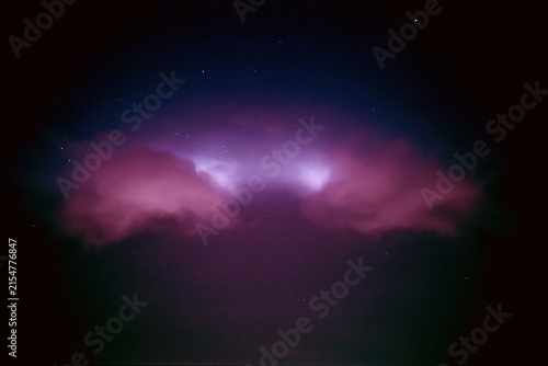 The Aurora Cloud Painting Across a Dark Starry Night Sky