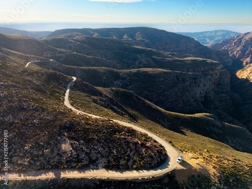 Aerial of winding dirt road mountain pass, Swartberg pass, South Africa