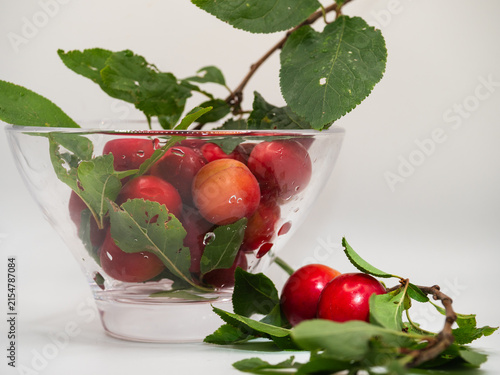 Ripe red cherries fruit in a bowl