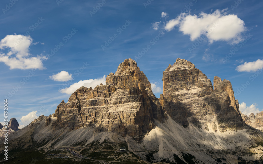 Obraz premium Mountain landscape panorama Tre Cime Mount against a blue summer background. 