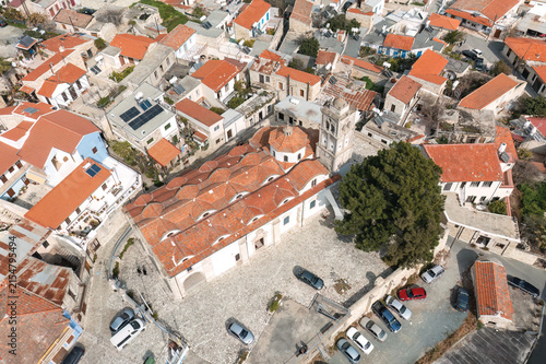 Captivating aerial view showcasing the traditional architecture and vibrant red roofs of Pano Lefkara village in Cyprus, highlighting its historical charm. Larnaca District, Cyprus