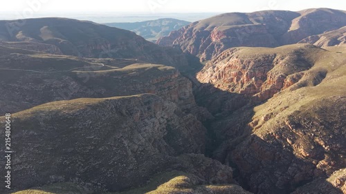 Aerial of winding dirt road mountain pass, Swartberg pass, South Africa