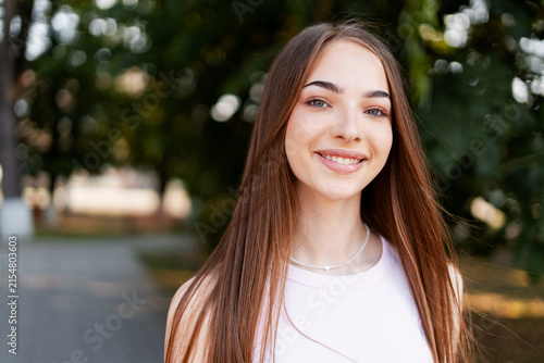 Photography Portrait of smiling young woman outdoors