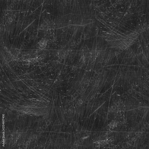 Fotografie Scratched dark surface texture displays a chaotic pattern of abrasions and marks