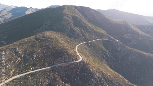 Aerial of winding dirt road mountain pass, Swartberg pass, South Africa