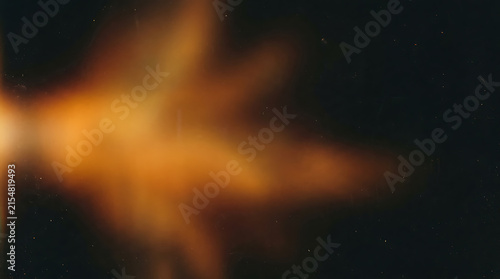 Abstract dark background with warm golden bokeh light streaks and cinematic glow for artistic tech branding