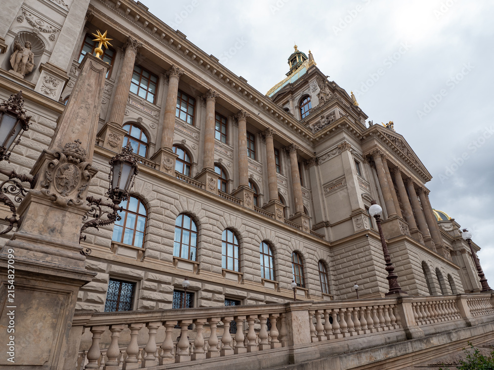 Obraz premium Side view of the historic National Museum in Prague, Czech Republic, featuring grand Neo-Renaissance architecture, columns, ornate facade and decorative details.
