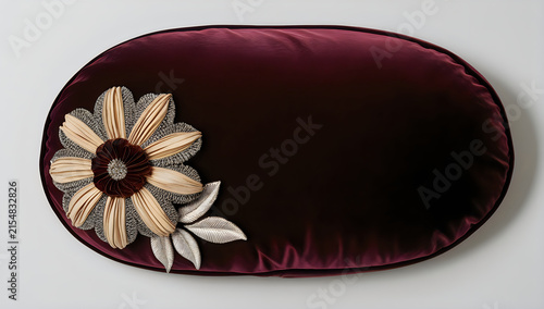 Oval black frame with a decorative flower and ribbon illustration