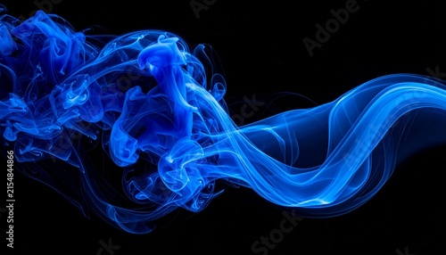 Abstract background featuring elegant blue smoke swirls and vibrant ink clouds flowing against a solid deep black background for artistic design.
