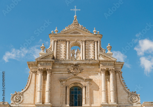 Crowning and tympanum on the facade of the Basilica of Santissima Annunziata in Ispica, province of Ragusa, Sicily, Italy.