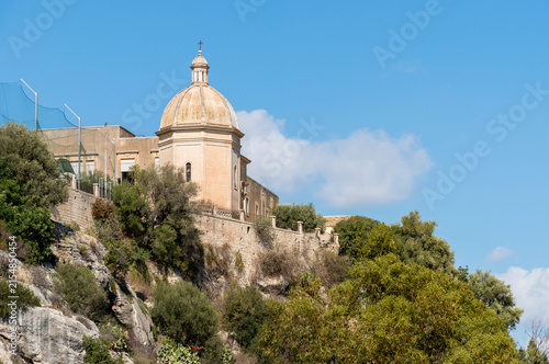 Historic Convent of Santa Maria di Gesù, perched on a rocky ridge overlooking Cava of Ispica in the province of Ragusa, Sicily, Italy