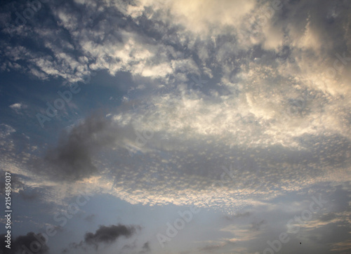 Quadro su tela Dramatic sky with altocumulus clouds, moody sunset sky background, natural cloud