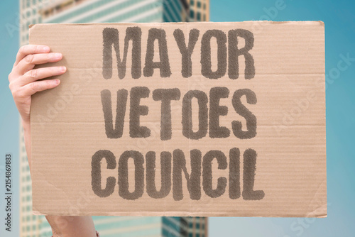 Fotografía "Mayor Vetoes Council" A mayor vetoes a council decision on a local development project