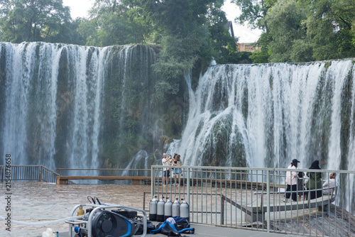 Pliva Waterfall in Jajce, Bosnia and Herzegovina surrounded by lush green forest