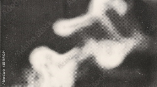 Abstract ethereal wisps of light and shadow dance in a dark, mysterious void, evoking a sense of the unknown.