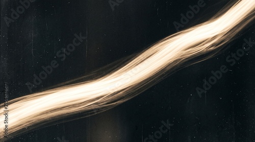 A luminous, wavy streak of light against a dark background, resembling a fiber optic cable or an energetic light trail.