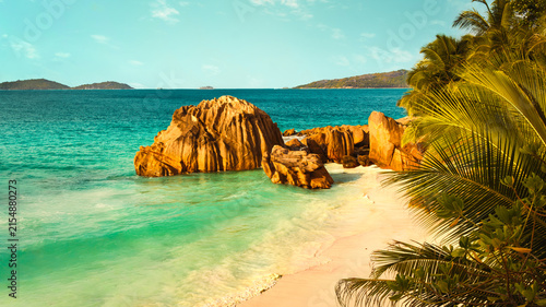 Granite boulders and turquoise water at Anse Patates Beach, La Digue, Seychelles