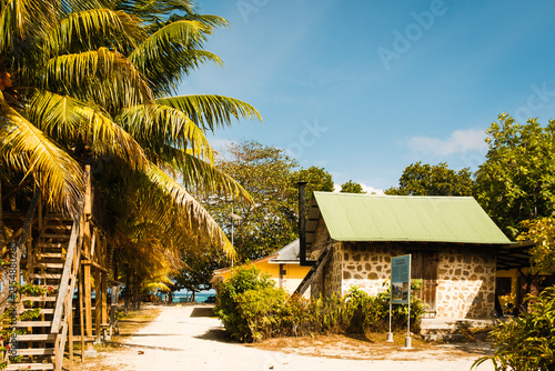 Stone copra kiln with chimney among coconut palms, L'Union Estate, La Digue, Seychelles