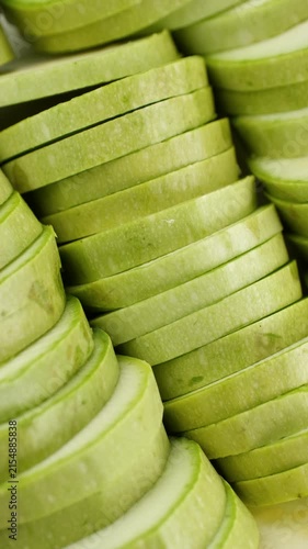 Sliced raw zucchini close up, rotation