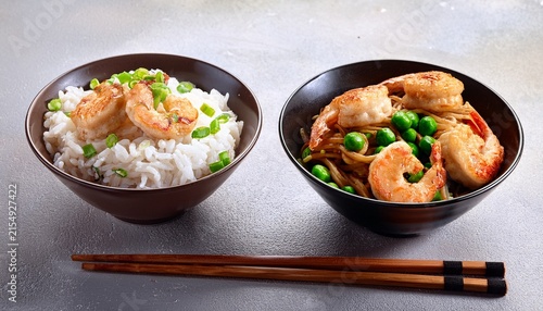 asian dumplings with rice and noodles bowls with shrimp and pea topping and chopsticks