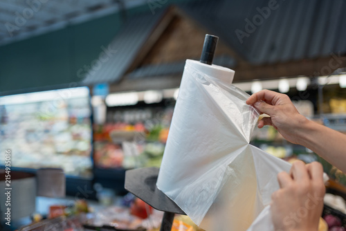 A Hand taking a plastic bag