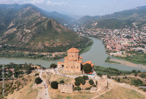 Aerial view of the ancient Jvari Monastery surrounded by mountains, rivers, and the town of Mtskheta, Georgia