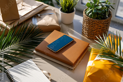 Top-down composition of smartphone, shopping bags, parcels and notebook on a neutral desk, online coupon savings theme, soft diffused lighting,, perfect for modern design, travel, or lifestyle